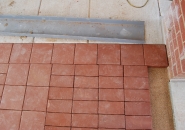 Clay pavers shrink during the firing process causing variation in size